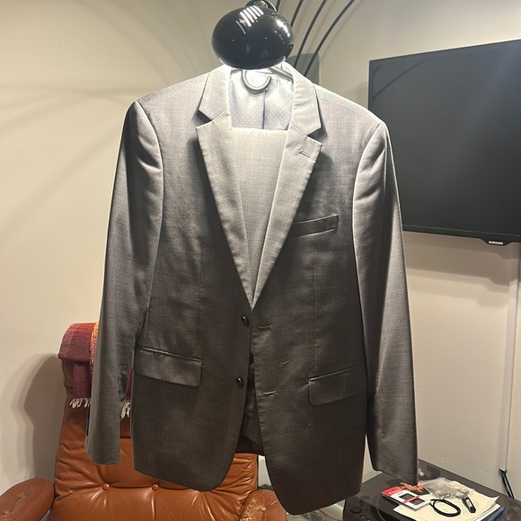 Beautiful Grey Suit. Never been worn in pristine condition